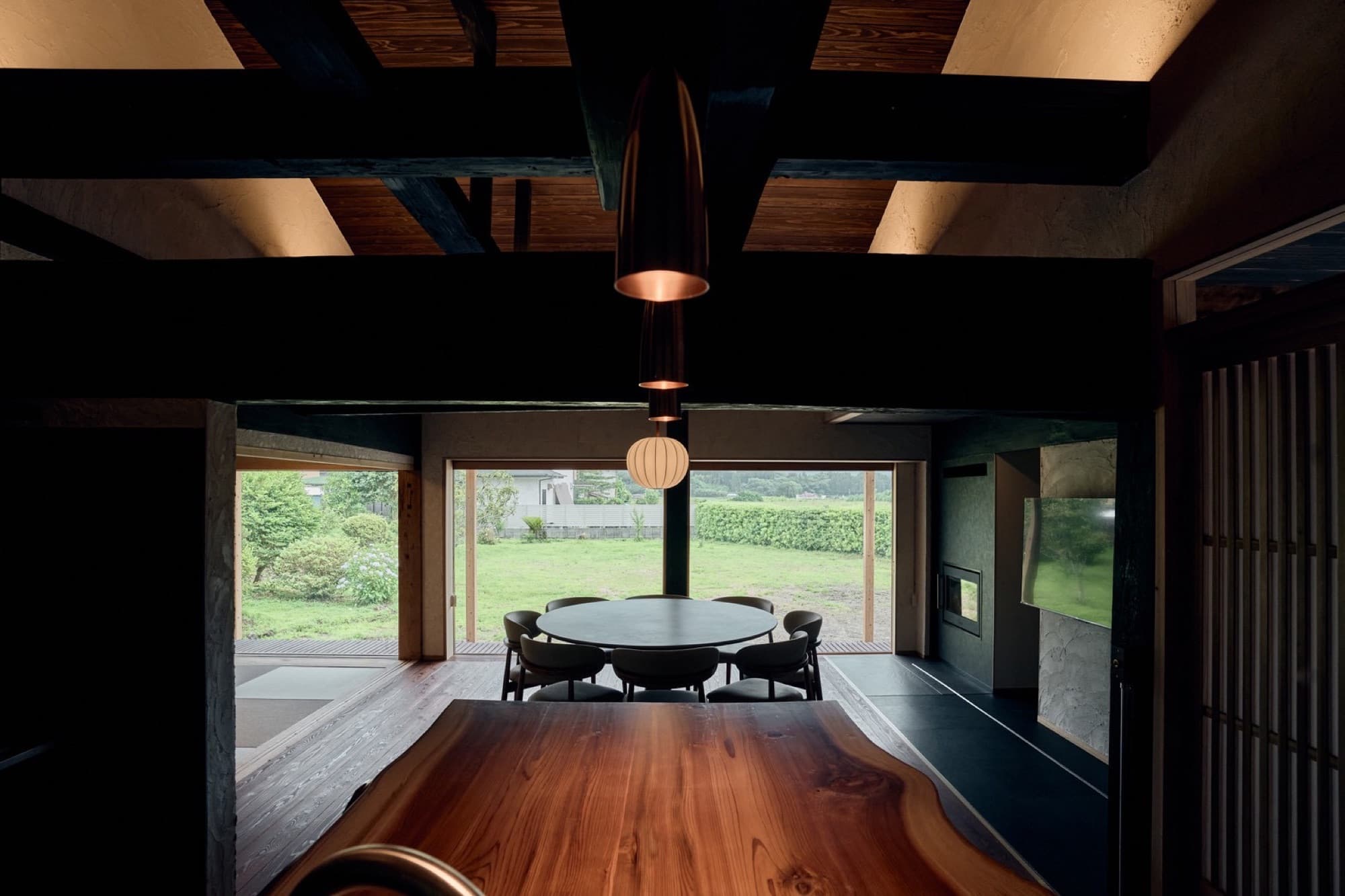 The dark timber dining hall of Nagomi, looking out over the garden