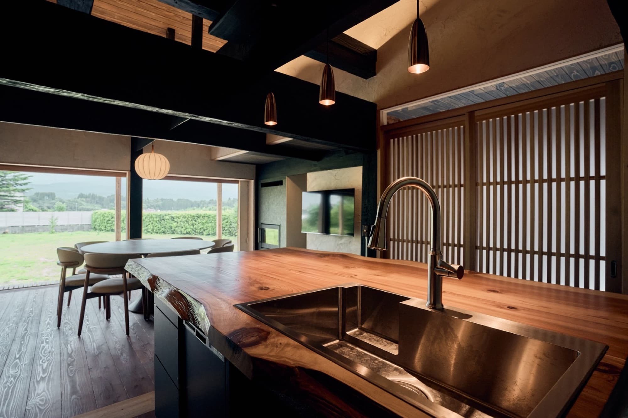 The kitchen island looking out to the garden at dusk